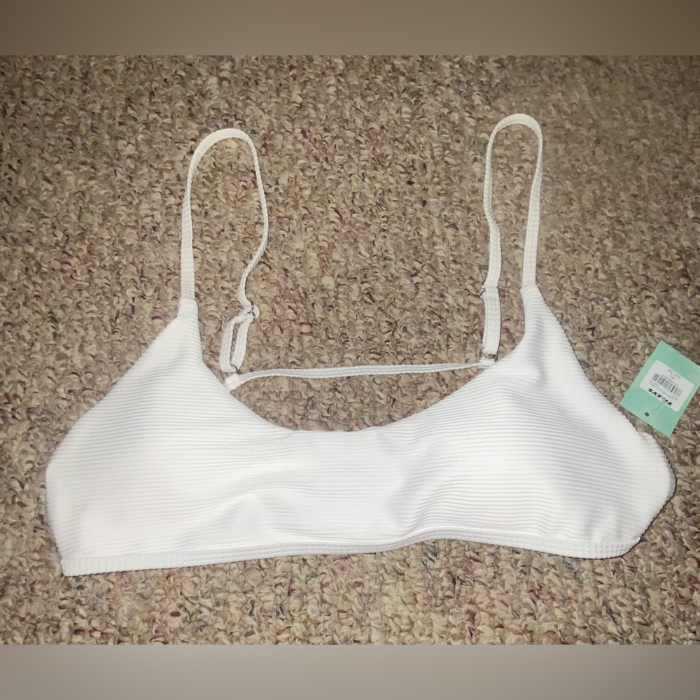 white, top only, new with tags, never worn, perfect condition, padding
